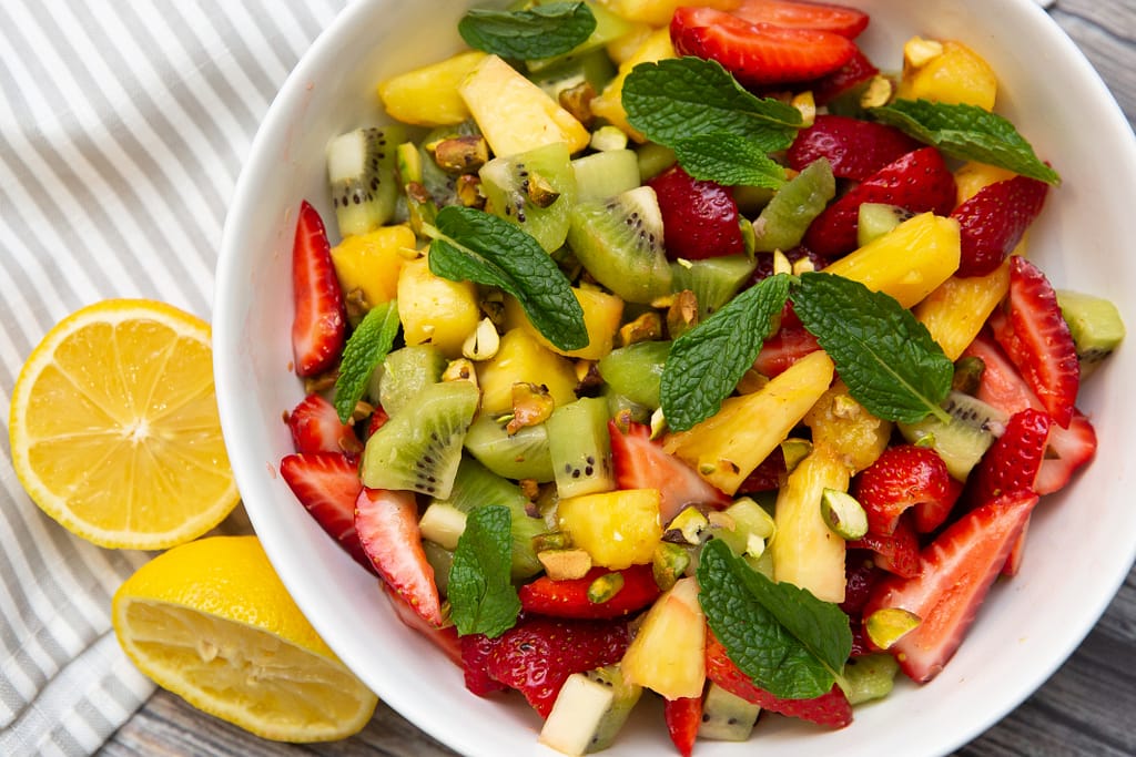 Tropical Fruit Salad with Pistachios and Honey Lemon Dressing Tasty